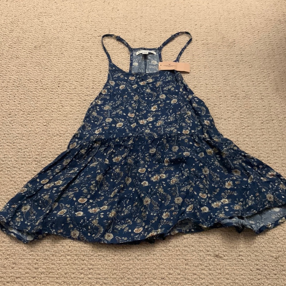 NWT American Eagle flowy top. Blue with flowers. Adjustable straps. Size XS.